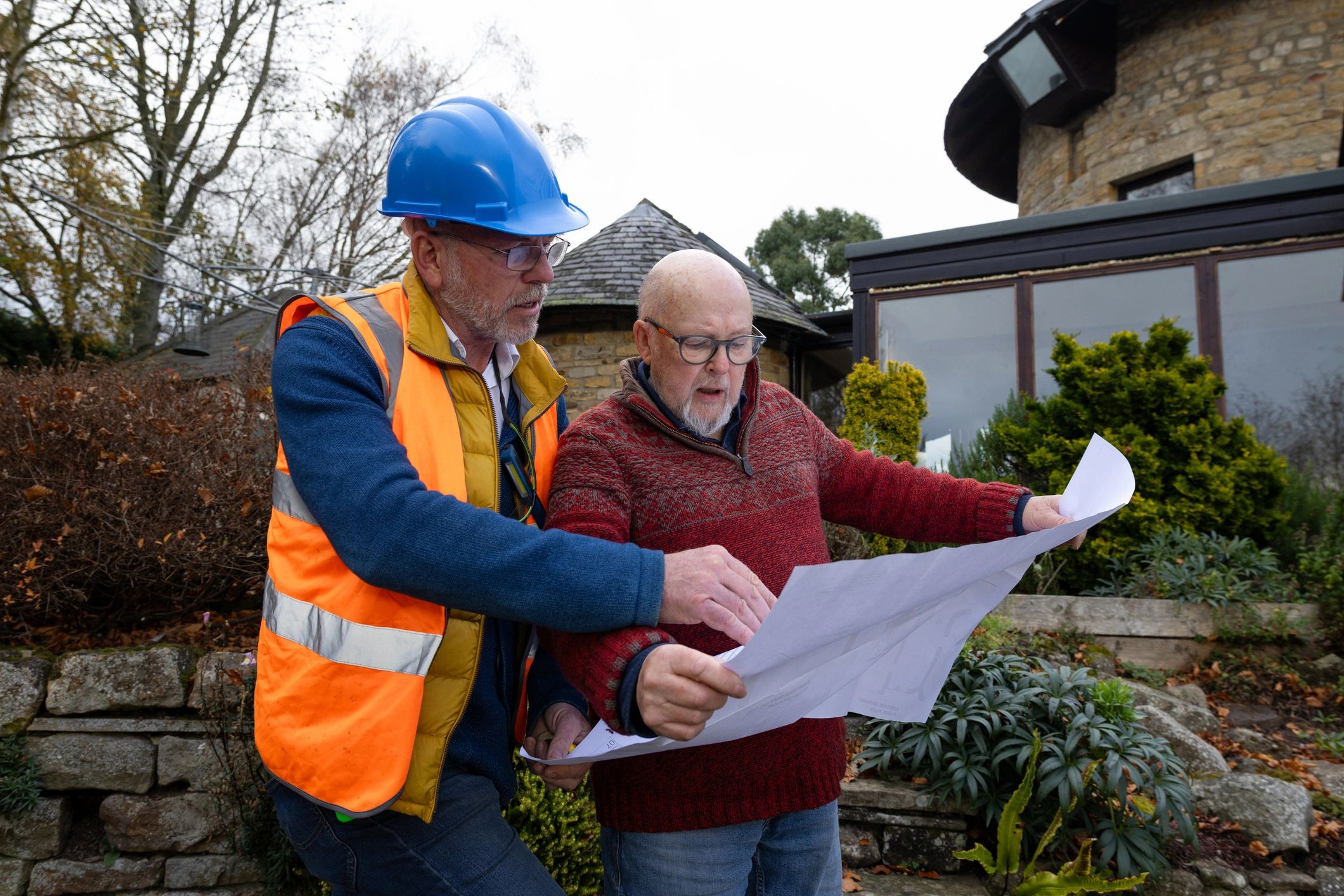Forensic engineer reviewing technical evidence with a project stakeholder.