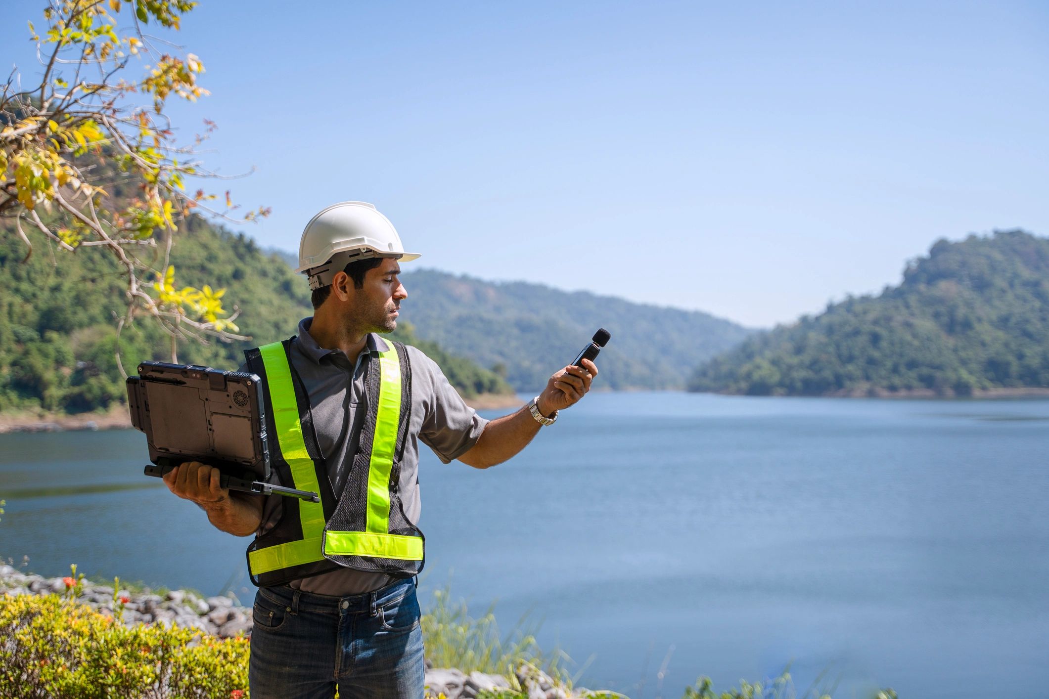 Engineering professional inspecting a dam structure