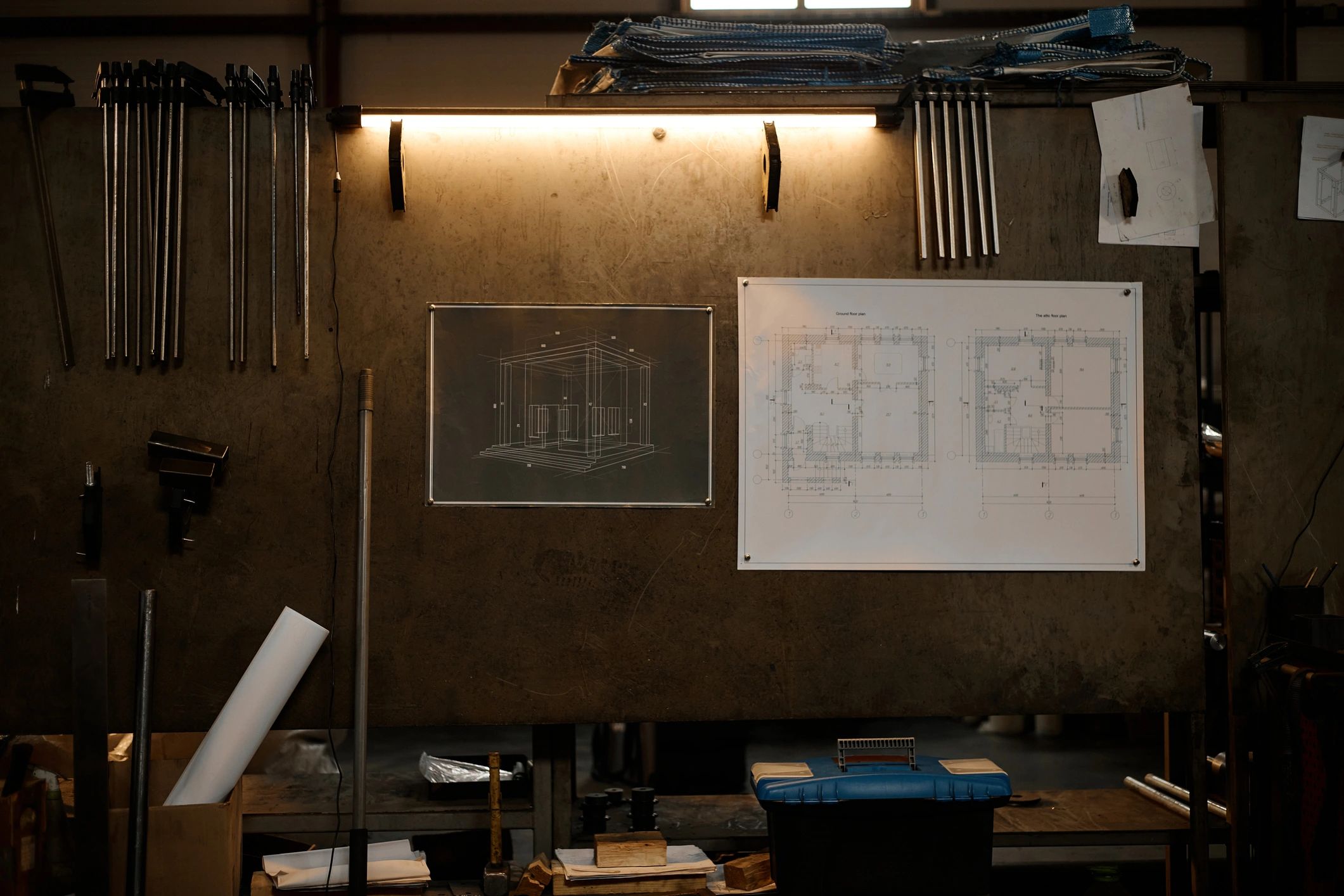 Engineering blueprints displayed in a workshop